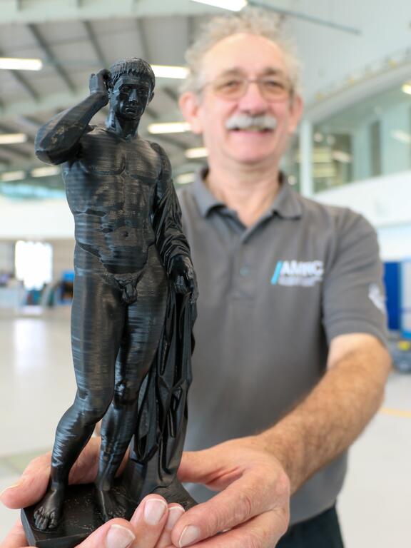 AMRC SME senior engineer, Phil Yates, holding one of the three miniature replicas of the Germanicus statue.