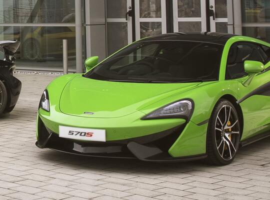 McLaren cars parked outside of AMRC Factory 2050